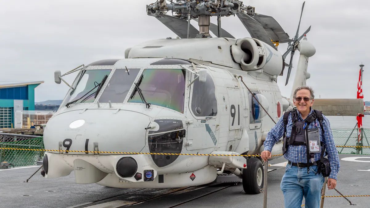 J​an next to an SH-60K helicopter on the deck of Japanese destroyer JS INAZUMA, in San Diego, CA (photo by Koshi Matsushita).