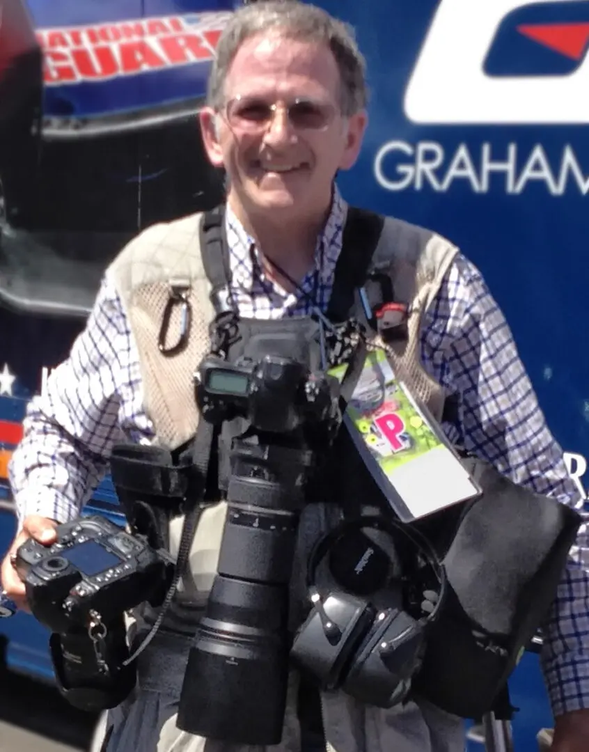 20140831 CU Jan wearing Cotton Carrier 2-Camera Vest System with lens pouch while covering INDYCAR race at Auto Club Speedway-IMG_3850-4in tall x 300dpi