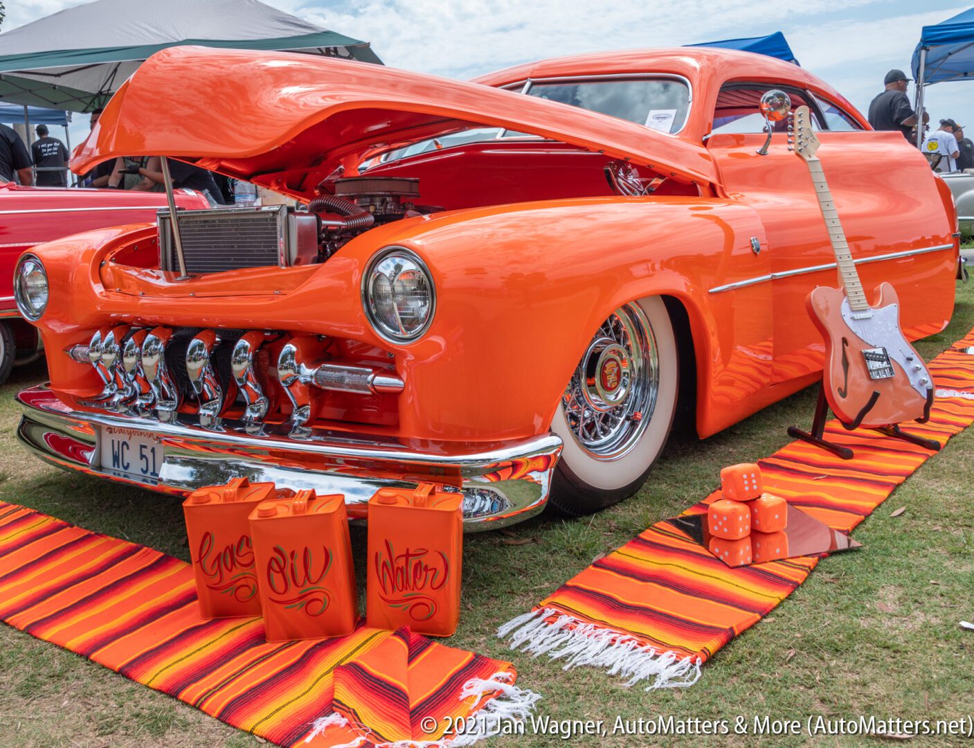 Very orange lowrider at the 2021 "Day At The Bay" custom car & bike show in San Diego