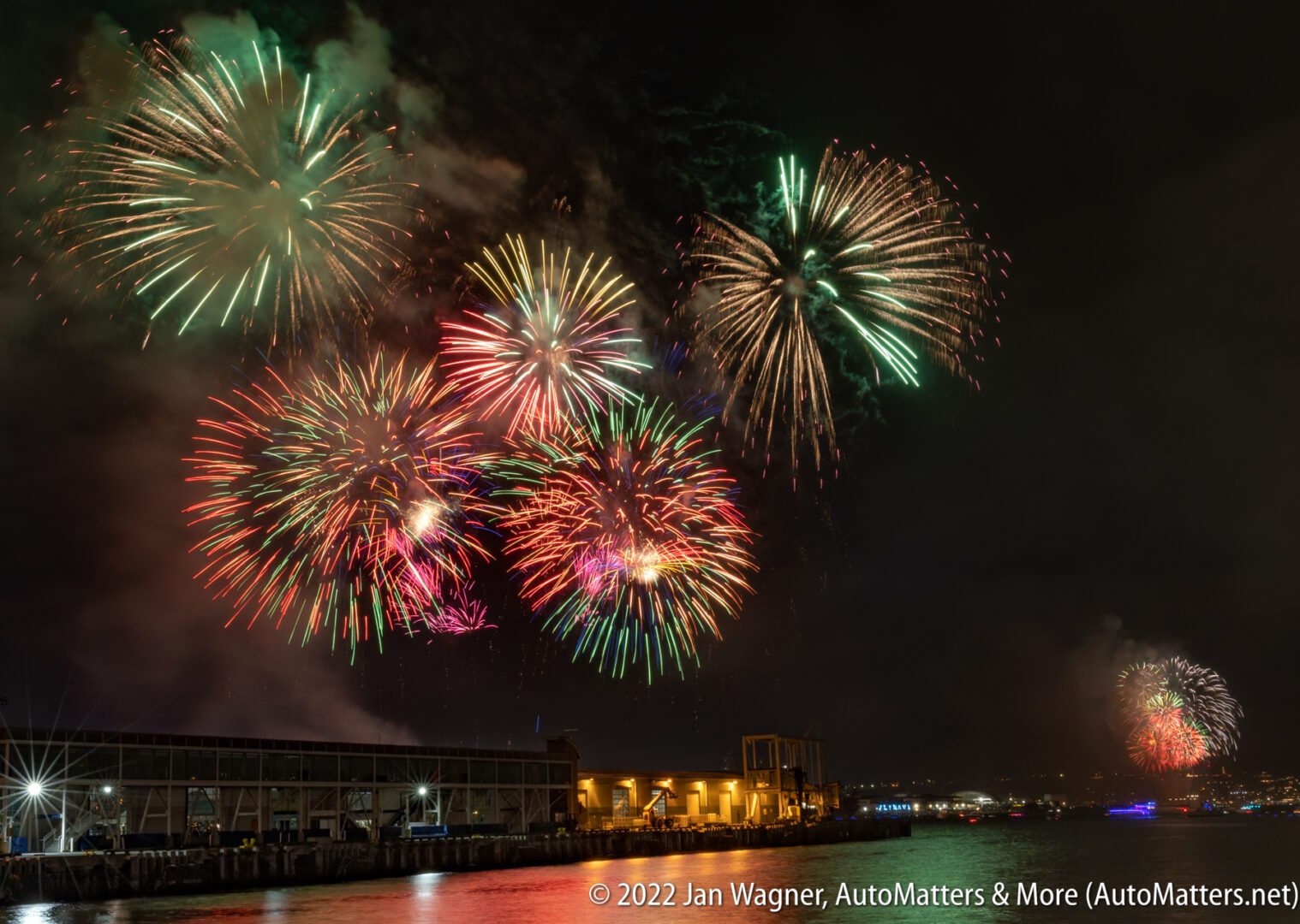 02085-20220704 Big Bay Boom fireworks in San Diego Bay-multiple bursts-black card on Bulb setting+ChargePoint EV car charging-24-70mm-R3