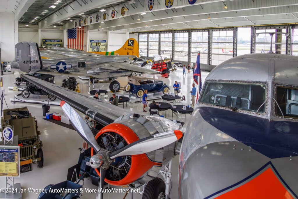 A group of people in a hangar.