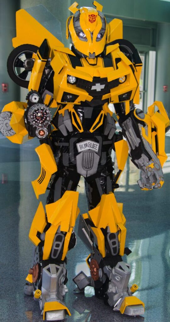 A yellow and black bumblebee costume standing in a hallway.