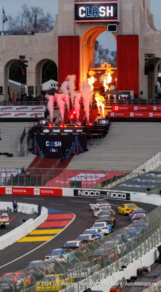 A race track with smoke coming out of the stage.