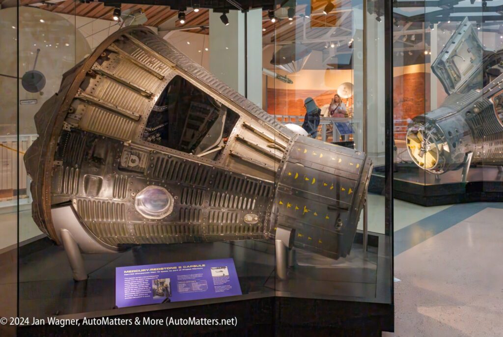 A spacecraft is on display in a museum.