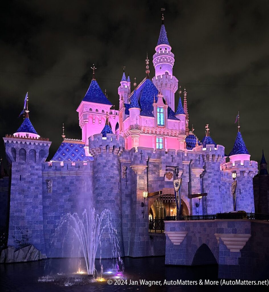 Disneyland's Sleeping Beauty Castle lit up at night.