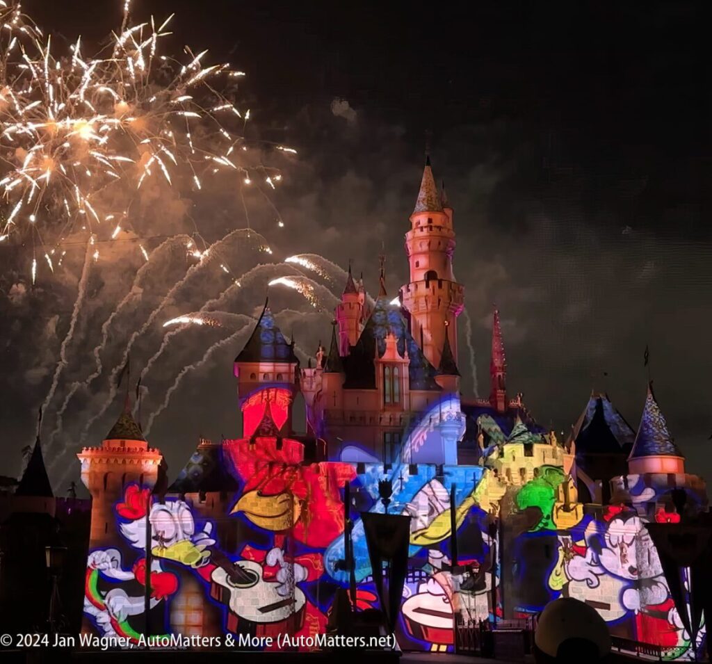 Disney's cinderella's castle lit up with fireworks.