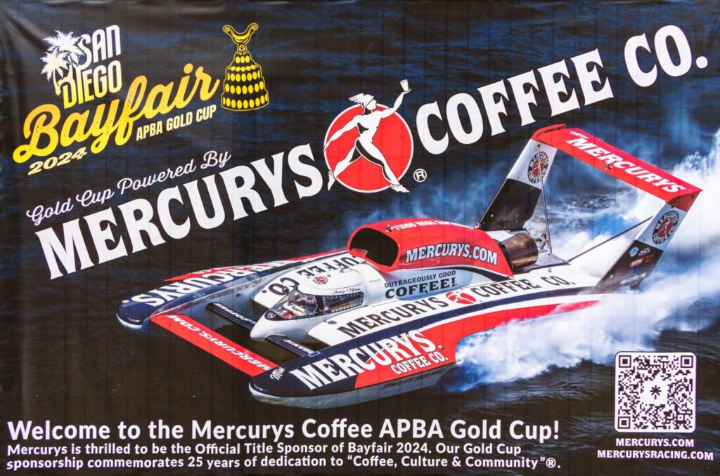 A promotional banner for the 2024 San Diego Bayfair APBA Gold Cup, featuring a Mercury's Coffee Co. branded hydroplane racing boat and event sponsorship details.