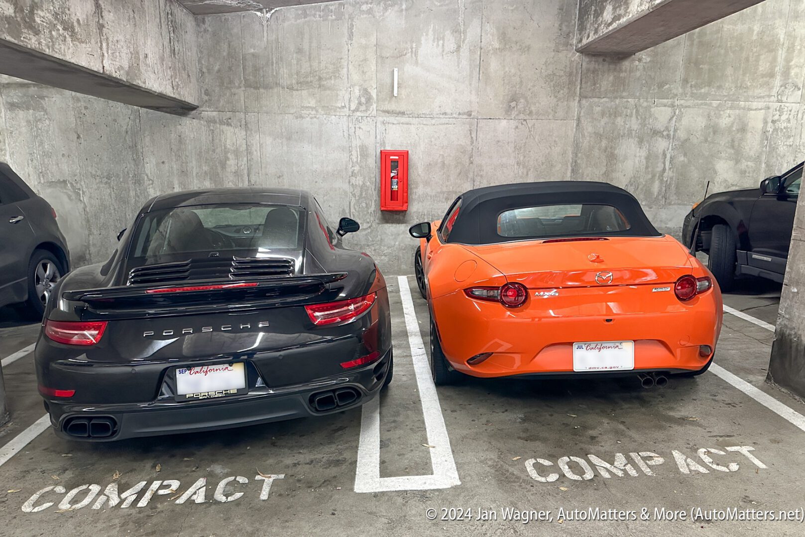 02341-20240918 Widebody Porsche 911 parked over the painted line in a narrow COMPACT parking spot at Scripps Hospital parking structure A—1 foot from my Miata—iPh14PM