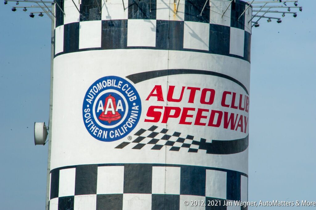 A white tower with a black-checkered pattern displays the Auto Club Speedway and AAA Southern California logos.