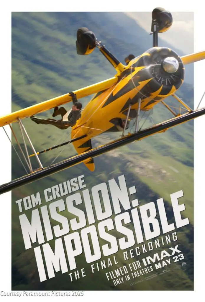 Tom Cruise hangs from the wing of a yellow biplane in midair for the "Mission: Impossible – The Final Reckoning" movie poster, with IMAX release date details shown.