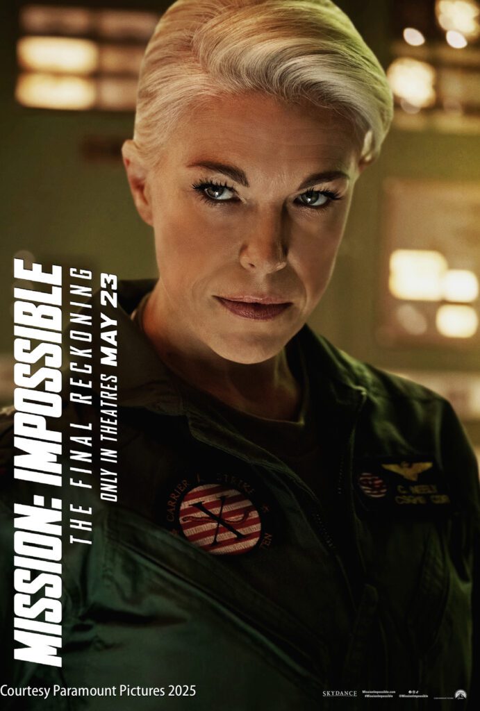 A person in a military-style uniform with short blonde hair looks directly at the camera; "Mission: Impossible The Final Reckoning" and release date details are displayed on the left side.