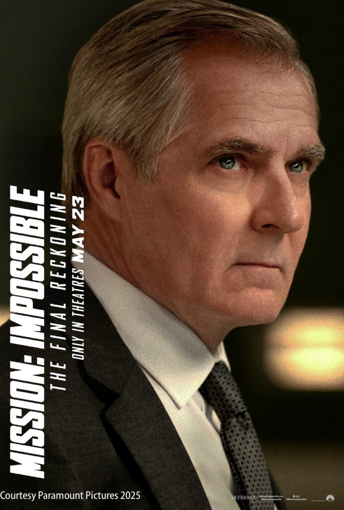 A serious-looking man in a suit and tie is featured in a promotional poster for "Mission: Impossible – The Final Reckoning," releasing in theaters May 23.