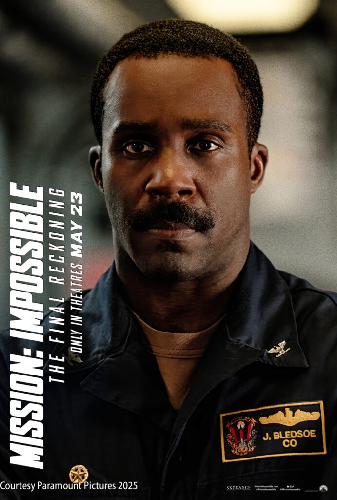 A man in a navy uniform with a patch reading "J. Bledsoe CO" appears on a poster for "Mission: Impossible – The Final Reckoning," with a release date of May 23.