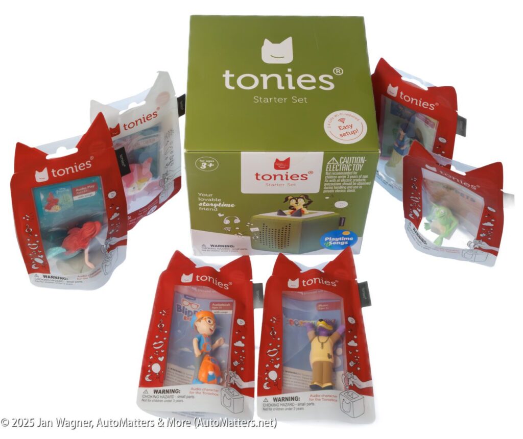 Toniebox Starter Set with six Tonies figurines in packaging, displayed around a green Toniebox box.