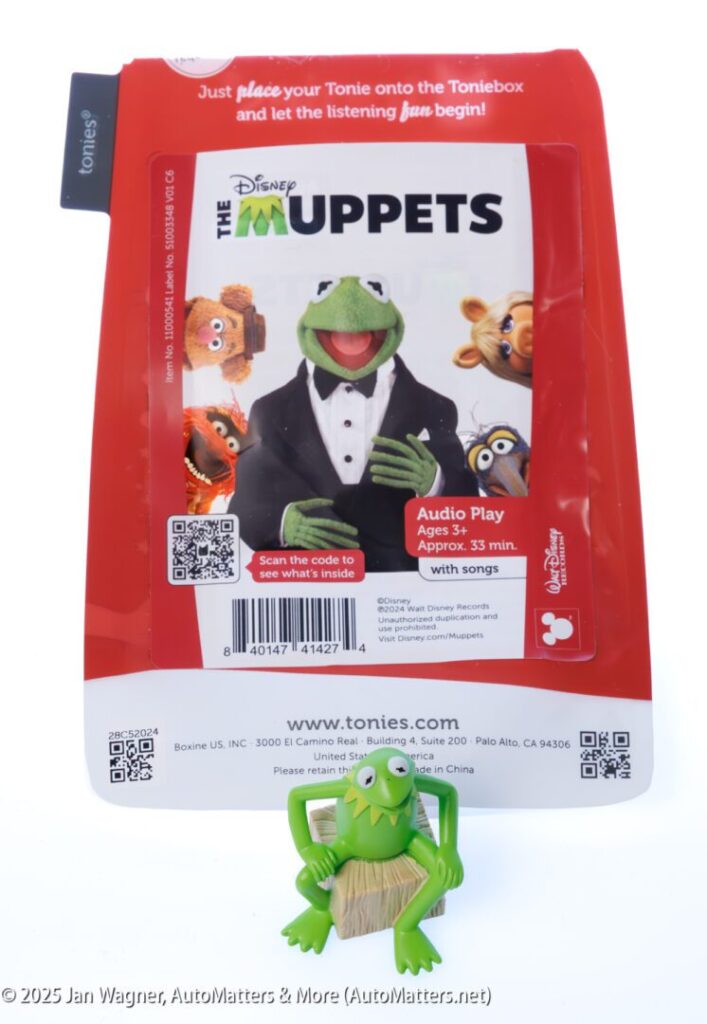 A Tonies audio play pack featuring "The Muppets" with Kermit the Frog on the cover and a small Kermit figurine placed in front of the package.