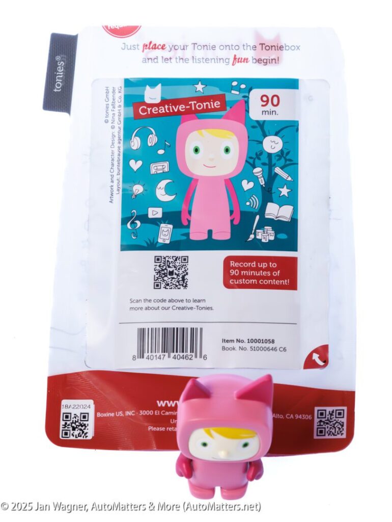 A Creative-Tonie figurine in a pink costume is displayed in front of its packaging, which advertises the ability to record up to 90 minutes of custom content.