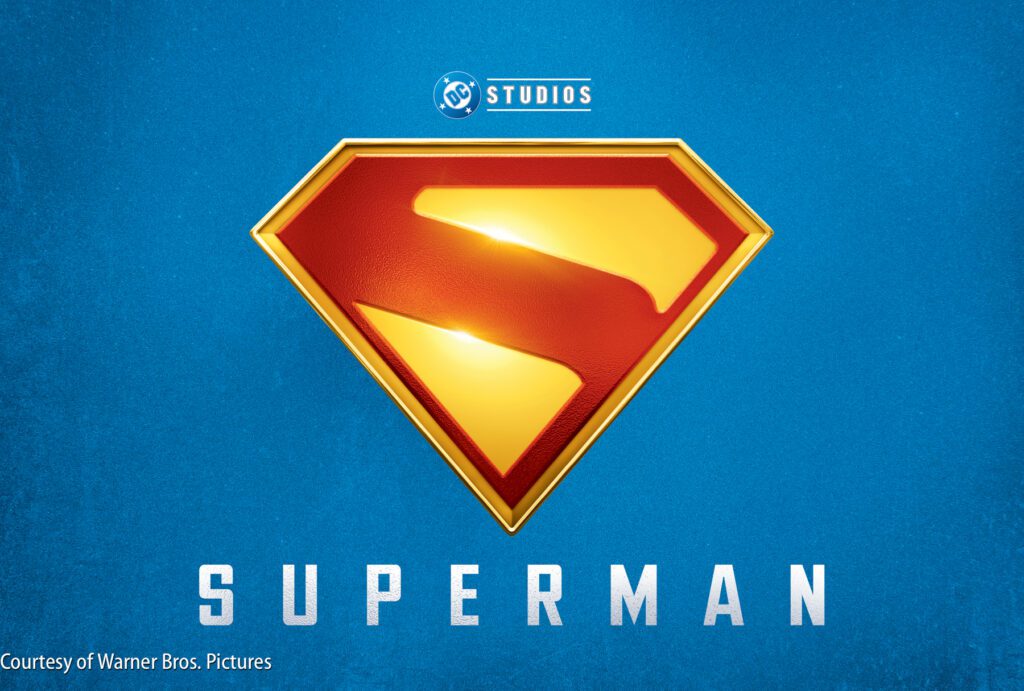 The Superman logo with a red and yellow “S” shield is displayed on a blue background with DC Studios and the word “Superman” below.