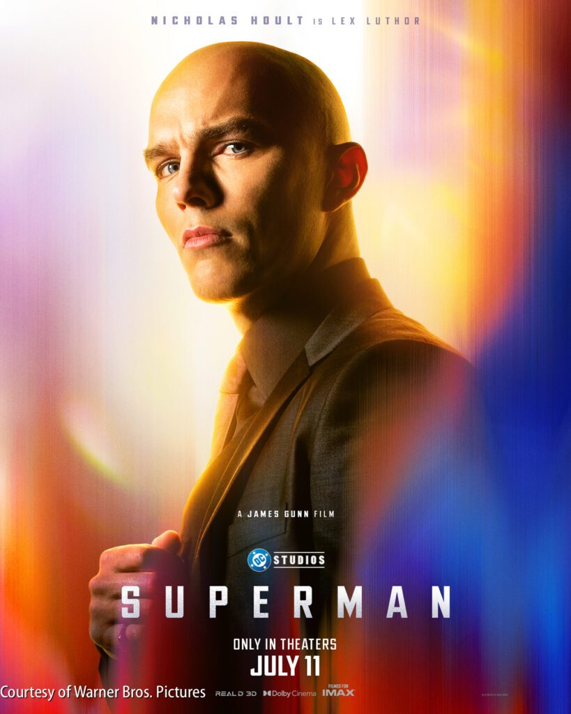 A bald man in a suit stands with a serious expression against a colorful background. Text reads: "Nicholas Hoult is Lex Luthor. Superman. Only in theaters July 11.