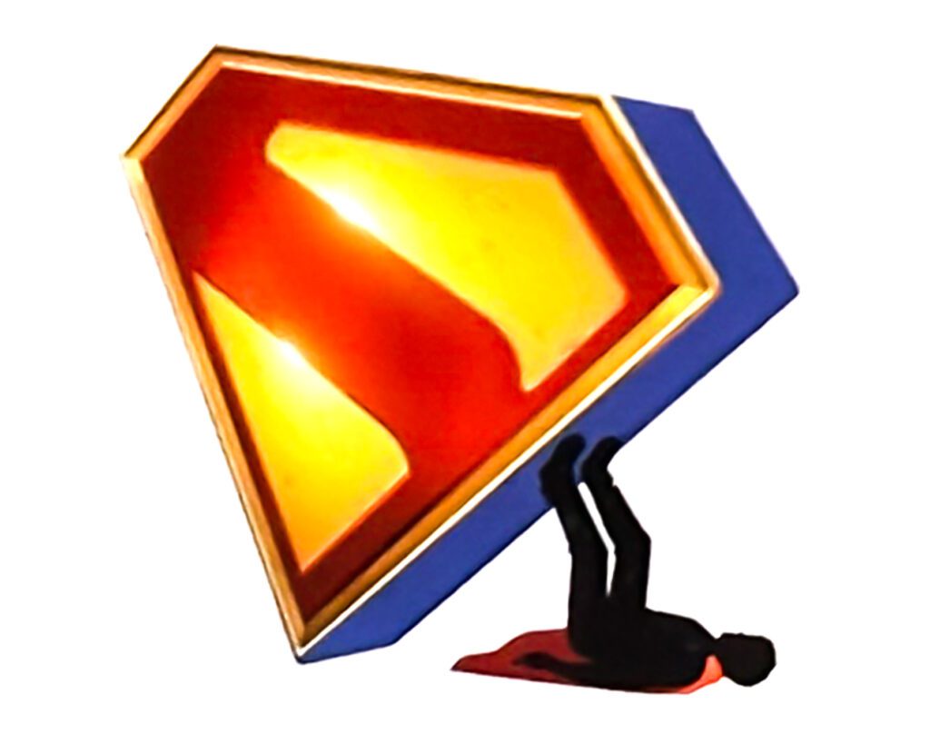 A person lies on their back, appearing crushed beneath a large, three-dimensional Superman logo.