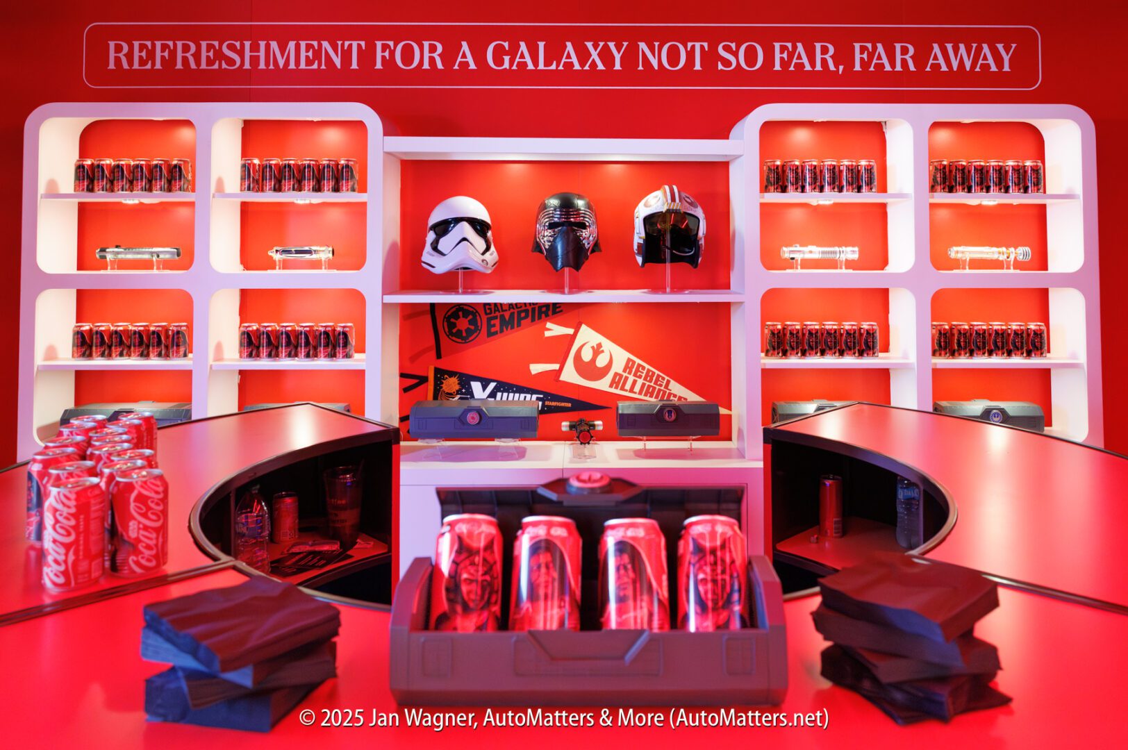 Red display with Coca-Cola products, Star Wars helmets, themed signs, and bags under a banner reading "Refreshment for a galaxy not so far, far away.