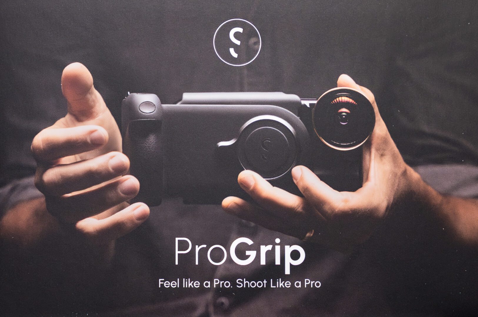 02435-20250710 Knotts Berry Farm—Ghost Town Alive+Summer Nights w VIDEO—bands+Hoedown+Galloping Goose railbus+Calico Mine ride—iPh14PM A person holds a ProGrip camera accessory with a lens attached; text below reads "ProGrip. Feel like a Pro. Shoot Like a Pro.