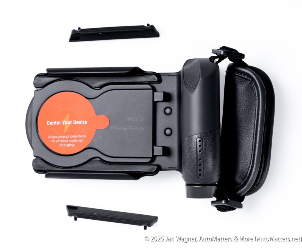 A black car phone mount with an orange “Center Your Device” label is displayed on a white background alongside two detachable side grip pieces.