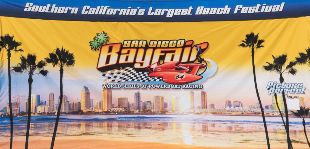 A banner for San Diego Bayfair, advertising the World Series of Powerboat Racing and calling it Southern California's Largest Beach Festival, with a cityscape and palm trees.