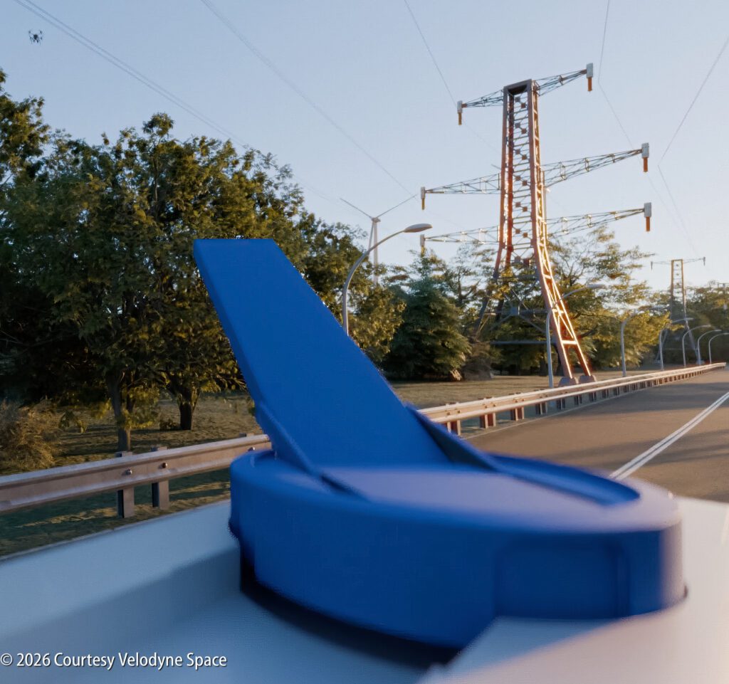 A blue lidar sensor is mounted on a vehicle beside a road, with power lines and trees visible in the background.