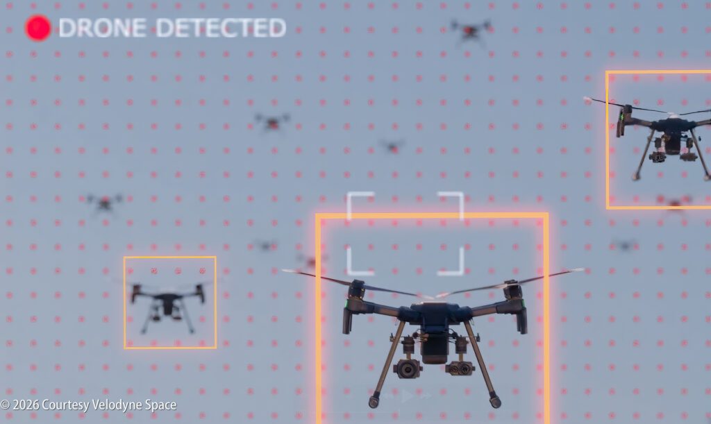 Several drones in the sky are highlighted with digital detection boxes, with text "DRONE DETECTED" indicating drone identification.