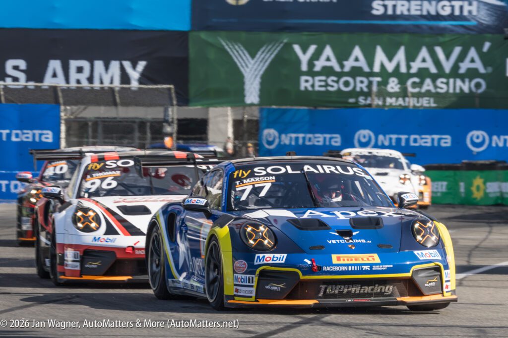 Three race cars compete on a track, with the lead car bearing "SOLARIUS" and "Apex" branding. Trackside banners include "U.S. Army" and "YAAMAVA' Resort & Casino.