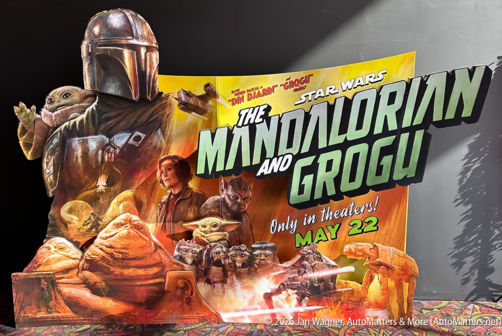 A cardboard movie display for "The Mandalorian and Grogu," featuring characters from the Star Wars series and a release date of May 22.