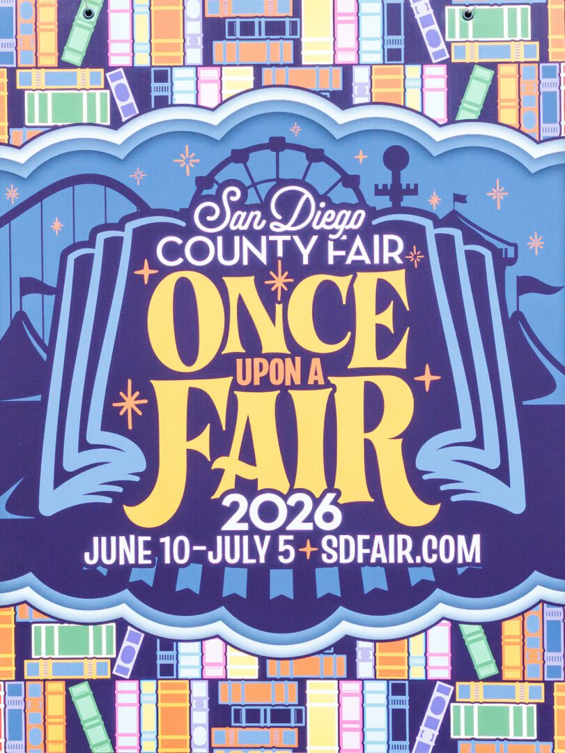 Poster for the 2026 San Diego County Fair themed "Once Upon a Fair," with event dates June 10–July 5 and the website sdfair.com. Colorful background with books and a fairground silhouette.