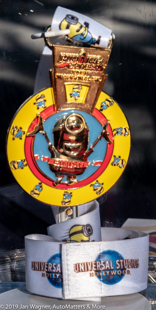 Universal Studios Hollywood lanyard with a medal featuring Minions and the word "FINISH," likely from a themed event or race.