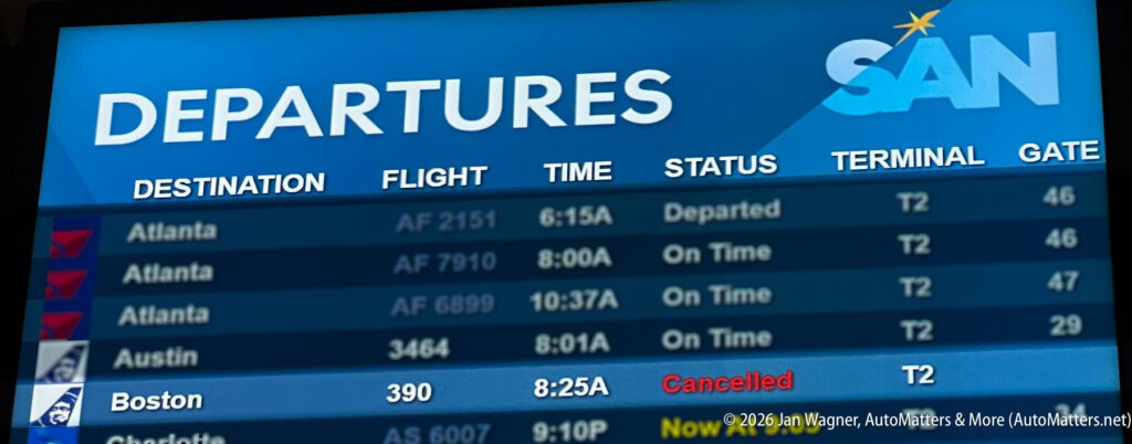 Airport departures board showing several flights to Atlanta and Austin as departed, with a Boston flight at 8:25 AM marked as cancelled.