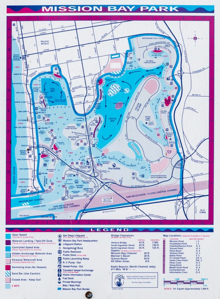 Topographic map of Mission Bay Park in San Diego, including a legend for waterway regulations, facilities, bridge clearances, and location coordinates.