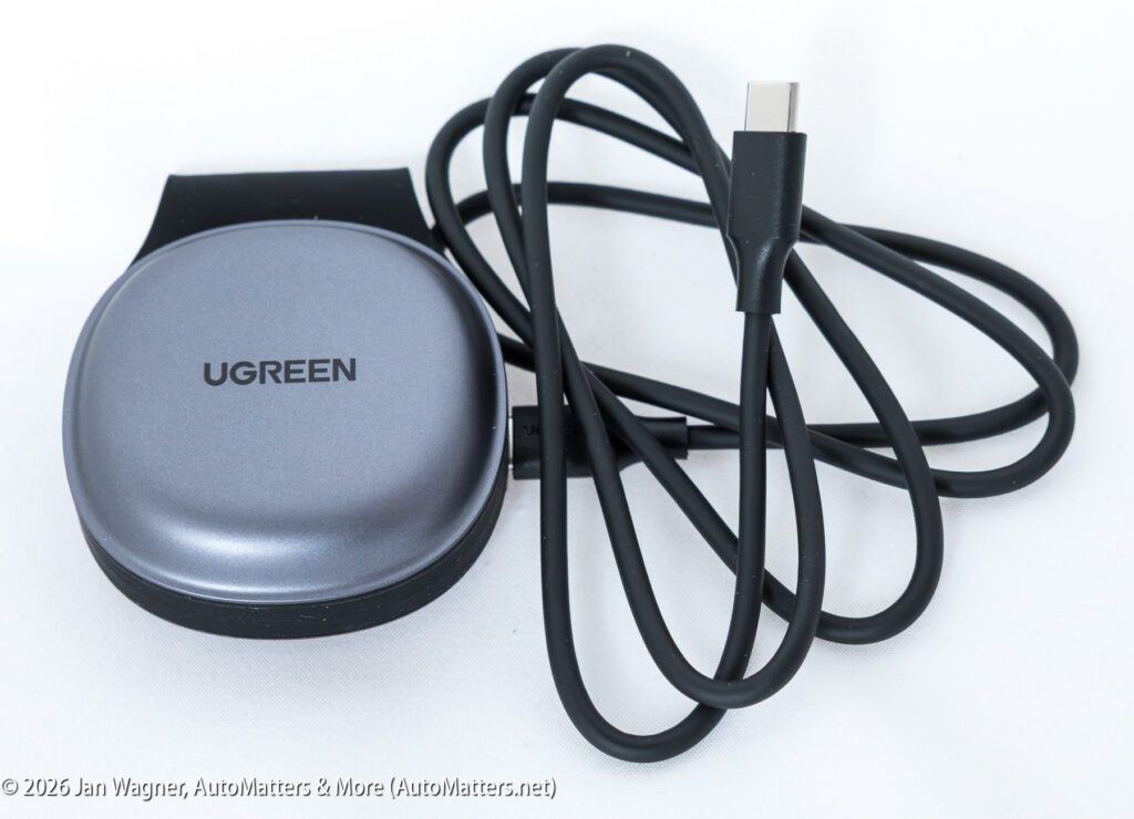 A UGREEN device with a USB-C cable is displayed on a white background.