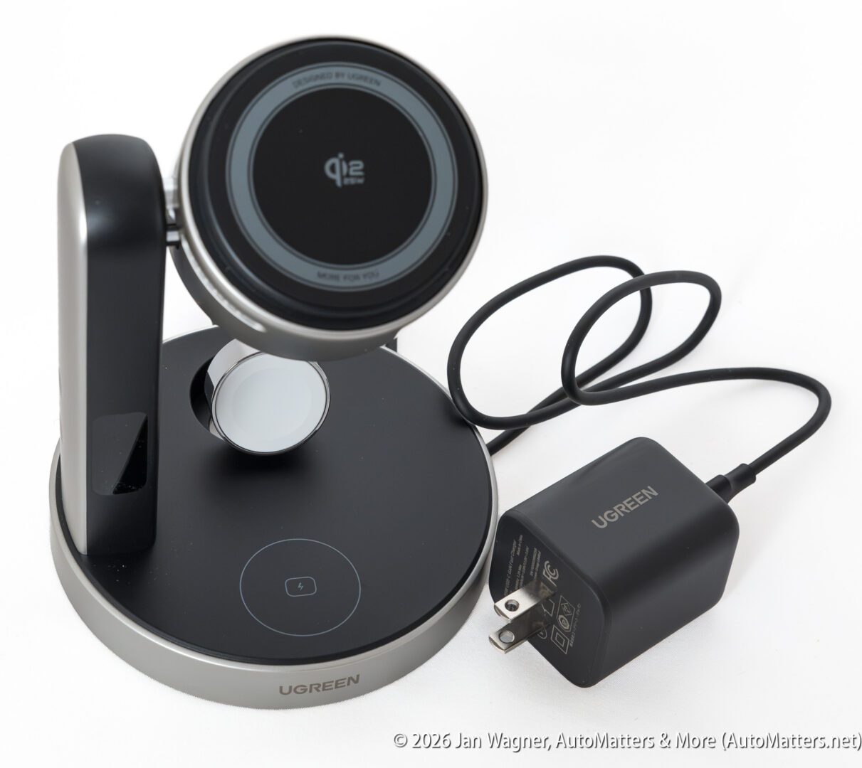 A UGREEN wireless charging stand with a circular charging pad, a secondary charging spot, and a power adapter with cord.