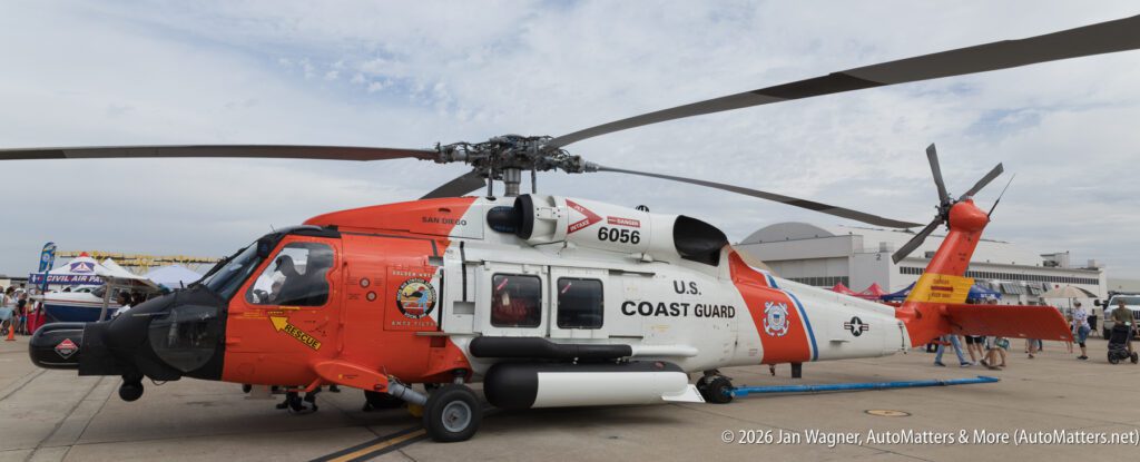 U.S. Coast Guard helicopter parked on an airfield.