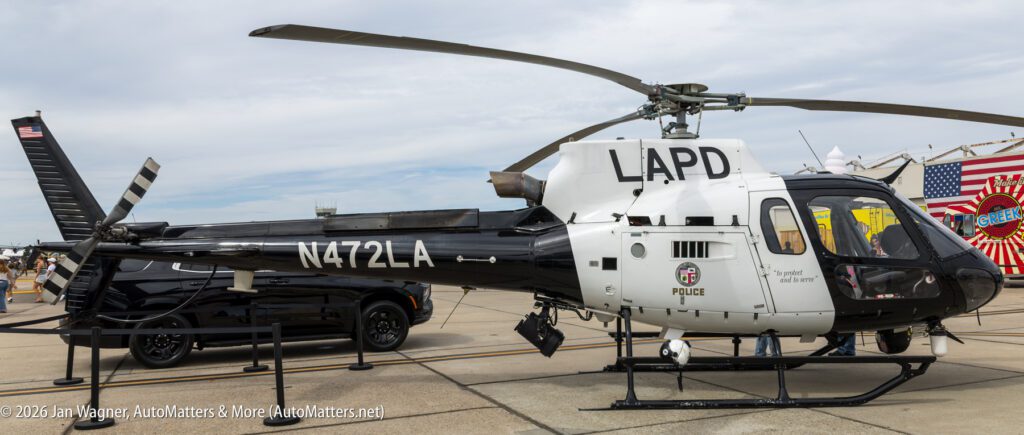 LAPD helicopter with identification number N472LA parked on an airfield.
