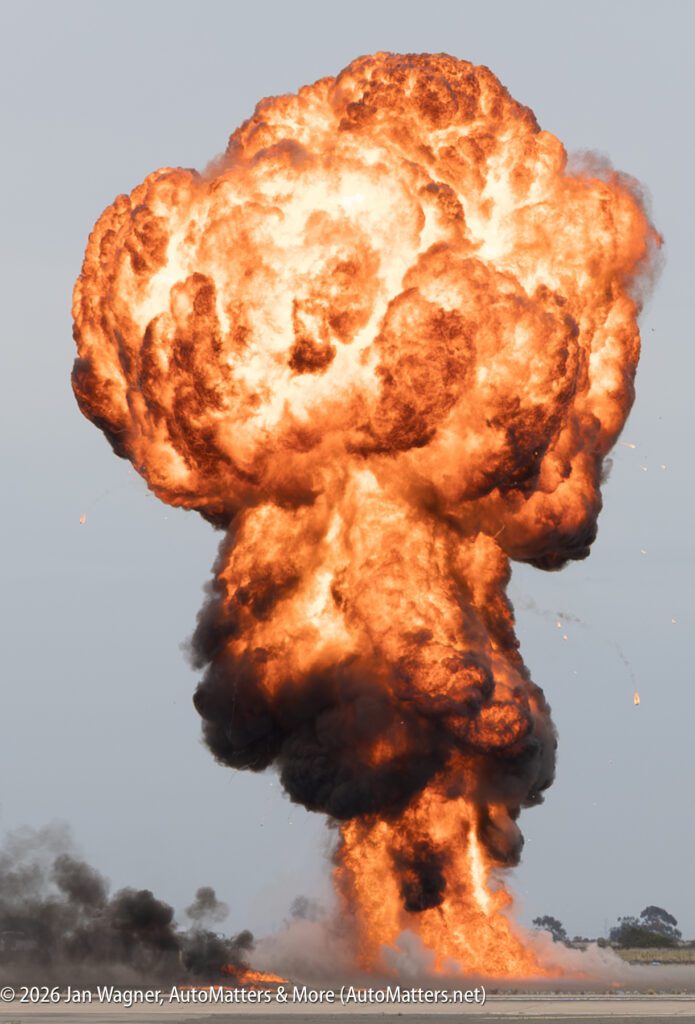 A large explosion resulting in a mushroom-shaped cloud of fire and smoke.