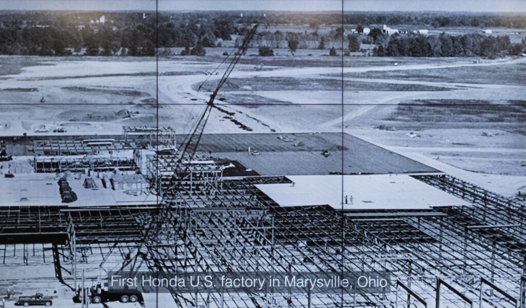 Aerial view of the Honda factory under construction in Marysville, Ohio, with a large crane visible on the site.